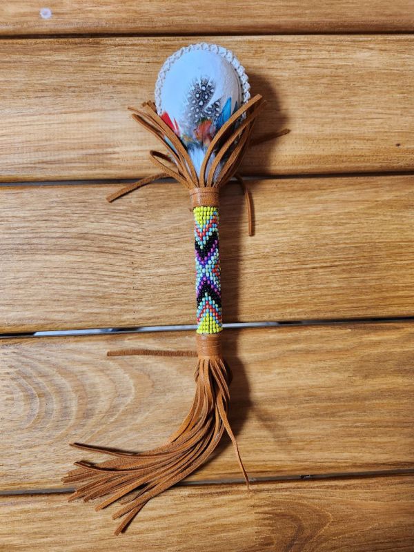 Maracas pelotero calf eggs, leather, hand-beaded and Amazonian bird feathers