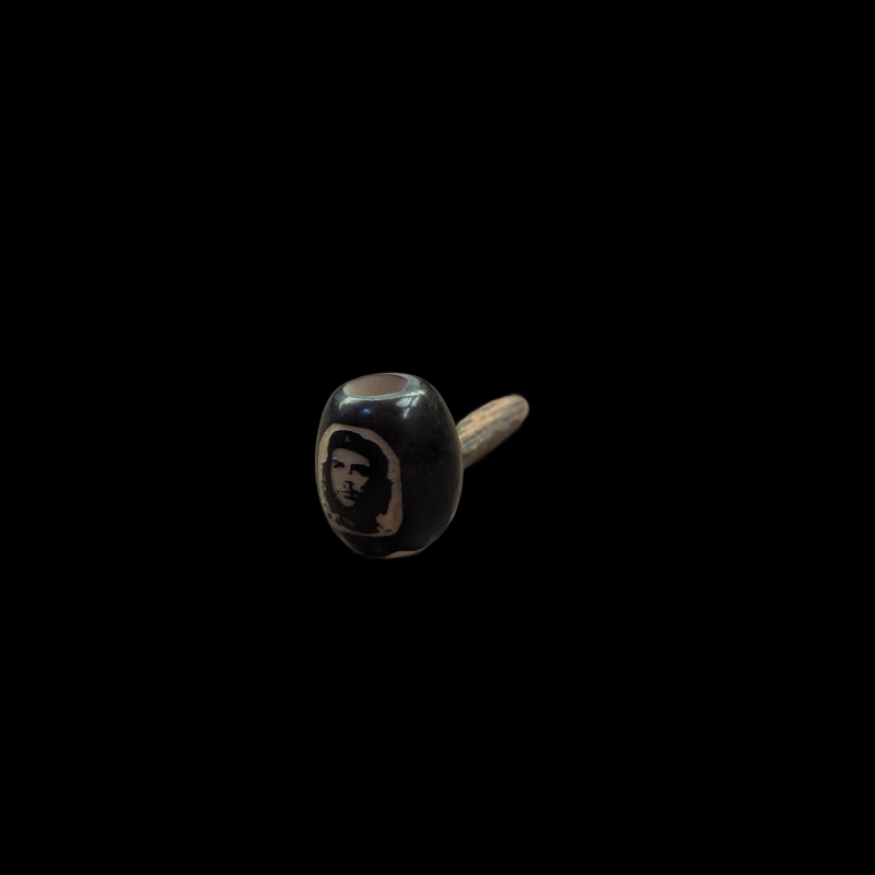 A pipe made of stone and wood Face